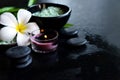 Thai Spa.  Top view of white Plumeria flower setting for massage treatment and relax on concrete blackboard with copy space. Royalty Free Stock Photo