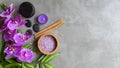 Thai Spa Treatments aroma therapy salt and sugar scrub massage with purple orchid flower on backboard with candle