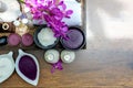 Thai Spa Treatments aroma therapy salt and sugar scrub and rock massage with orchid flower on wooden.