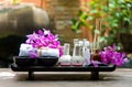 Thai Spa Treatments aroma therapy salt and sugar scrub and rock massage with orchid flower on wooden white. Royalty Free Stock Photo