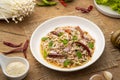 Thai spicy salad with Golden Needle Mushroom and minced Pork Royalty Free Stock Photo