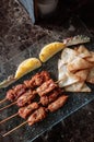 Thai spicy tender pork barbeque skewers with grill pineapple and Papadum crispy chips in glass plate Royalty Free Stock Photo