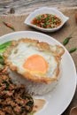 Thai Stir fried  basil with minced pork, chili and fried egg on topped rice. Royalty Free Stock Photo