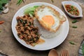 Thai Stir fried  basil with minced pork, chili and fried egg on topped rice. Royalty Free Stock Photo