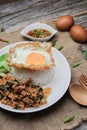 Thai Stir fried  basil with minced pork, chili and fried egg on topped rice. Royalty Free Stock Photo