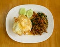 Thai stir fried basil with minced pork and fried egg eating with cooked rice Royalty Free Stock Photo