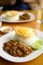 Thai stir fried basil with minced pork and fried egg eating with cooked rice Royalty Free Stock Photo