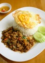 Thai stir fried basil with minced pork and fried egg eating with cooked rice Royalty Free Stock Photo