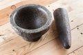 Thai stone mortar and pestle on wooden Royalty Free Stock Photo