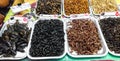 Thai street exotic food. Edible fried beetles, crickets