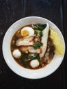 Thai street food : Spicy noddle soup with fish balls, red porks