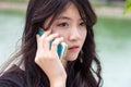 Thai student teen beautiful girl Answer the phone and smile Royalty Free Stock Photo