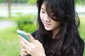 Thai student teen beautiful girl Answer the phone and smile Royalty Free Stock Photo