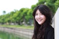 Thai student teen beautiful girl Black Dresses relax and smile. Royalty Free Stock Photo