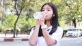 Thai student teen beautiful girl give drinking water