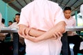 Thai students are arm crossing before eating lunch in the discipline conduct at Paknampran school, Paknampran, Pranburi, Thailand Royalty Free Stock Photo