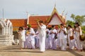 Thai students wear white clothes making a merit at the temple in Pranburi, Thailand July 21,2017