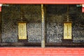 Thai style art painting wall and golden windows Thai temple bang Royalty Free Stock Photo