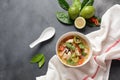 Thai style coconut milk soup-Tom Kha Gai with chicken, mushrooms, galangal, lime leaves, lemongrass, chili peppers. Royalty Free Stock Photo