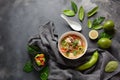 Thai style coconut milk soup-Tom Kha Gai with chicken, mushrooms, galangal, lime leaves, lemongrass, chili peppers. Royalty Free Stock Photo