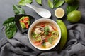 Thai style coconut milk soup-Tom Kha Gai with chicken, mushrooms, galangal, lime leaves, lemongrass, chili peppers. Royalty Free Stock Photo