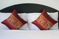 Thai style elephant pattern pillows on bed Royalty Free Stock Photo