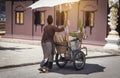 Thai style Ice cream cart and asian women with white fabric umbrella