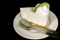 Thai style lime cream cake with teaspoon and fork on white ceramic plate Royalty Free Stock Photo