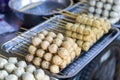 Thai style meatballs on skewers It will come in a cart to be sold on the public side of the road. There is a pan and hot oil for Royalty Free Stock Photo