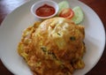 Thai style pork omelette. Minced pork omelet over rice.