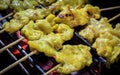 Thai style roast pork skewers Pork steak grilled on charcoal for sell at street market. Bangkok, Thailand. Selective focus. Royalty Free Stock Photo