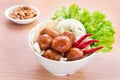 Thai style sausages with fresh vegetables in bowl and peanuts, T Royalty Free Stock Photo