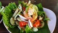 Thai style seafood salad served on a white plate Royalty Free Stock Photo