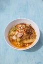 Thai style spicy Tom yum egg noodle with roasted pork Royalty Free Stock Photo