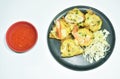 Thai sweetmeat grilled Mortar-toasted pastry seafood  coconut cream hotcake called Kanom Krok dipping chili sauce on plate Royalty Free Stock Photo