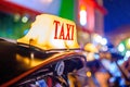 Thai Taxi (Tuk Tuk) sign with defocused lights blur , Chiang Mai