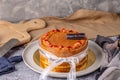 Thai tea layer cake decorated with strawberry and white ribbon for birthday cake. Royalty Free Stock Photo