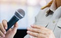 Thai Teacher Speaking in classroom or Conference meeting hall with Microphone of speech in seminar room on hall light bokeh Royalty Free Stock Photo