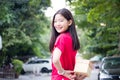 Thai teen beautiful girl in Chinese dress, happy new year and give gift, relax and smile. Royalty Free Stock Photo