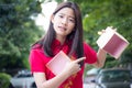 Thai teen beautiful girl in Chinese dress, happy new year and open box gift, unhappy. Royalty Free Stock Photo