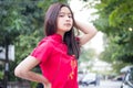 Thai teen beautiful girl in Chinese dress, relax and smile. Royalty Free Stock Photo