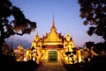 Thai temple glowing in golden light during sunset