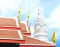 Thai temple roof and white pagoda with blue sky Royalty Free Stock Photo