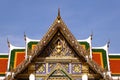 Thai temple roofs soar into blue sky Royalty Free Stock Photo