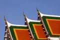 Thai temple roofs soar into blue sky Royalty Free Stock Photo