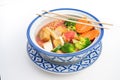 Thai Tofu Veggie dish in a traditional Thai bowl with chopsticks diagonally on top Royalty Free Stock Photo