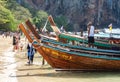 Thai traditional long boats on crowded Phra Nang Cave Beach, Railay in Krabi province, Thailand. Royalty Free Stock Photo