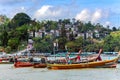 Thai traditional longtail wooden boats early morning on the Patong beach in Phuket