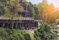 Thai train moving on death of railway world war II between tham krasae railway station kanchanaburi Thailand Royalty Free Stock Photo