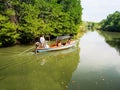 Thai travelers take the boat trip along the canal among the mangrove Royalty Free Stock Photo